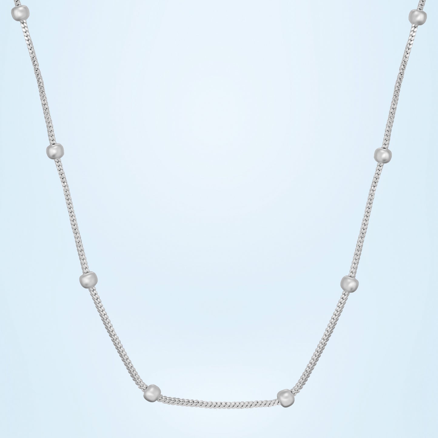 silver chain adorned