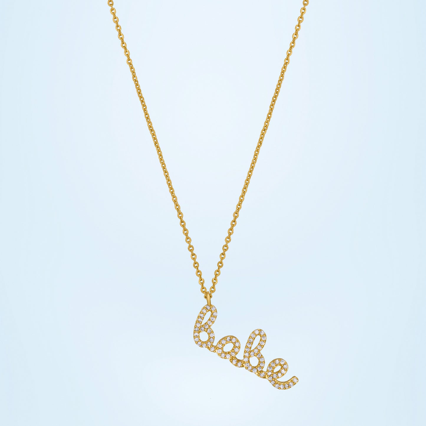 golden necklace with the word love on it