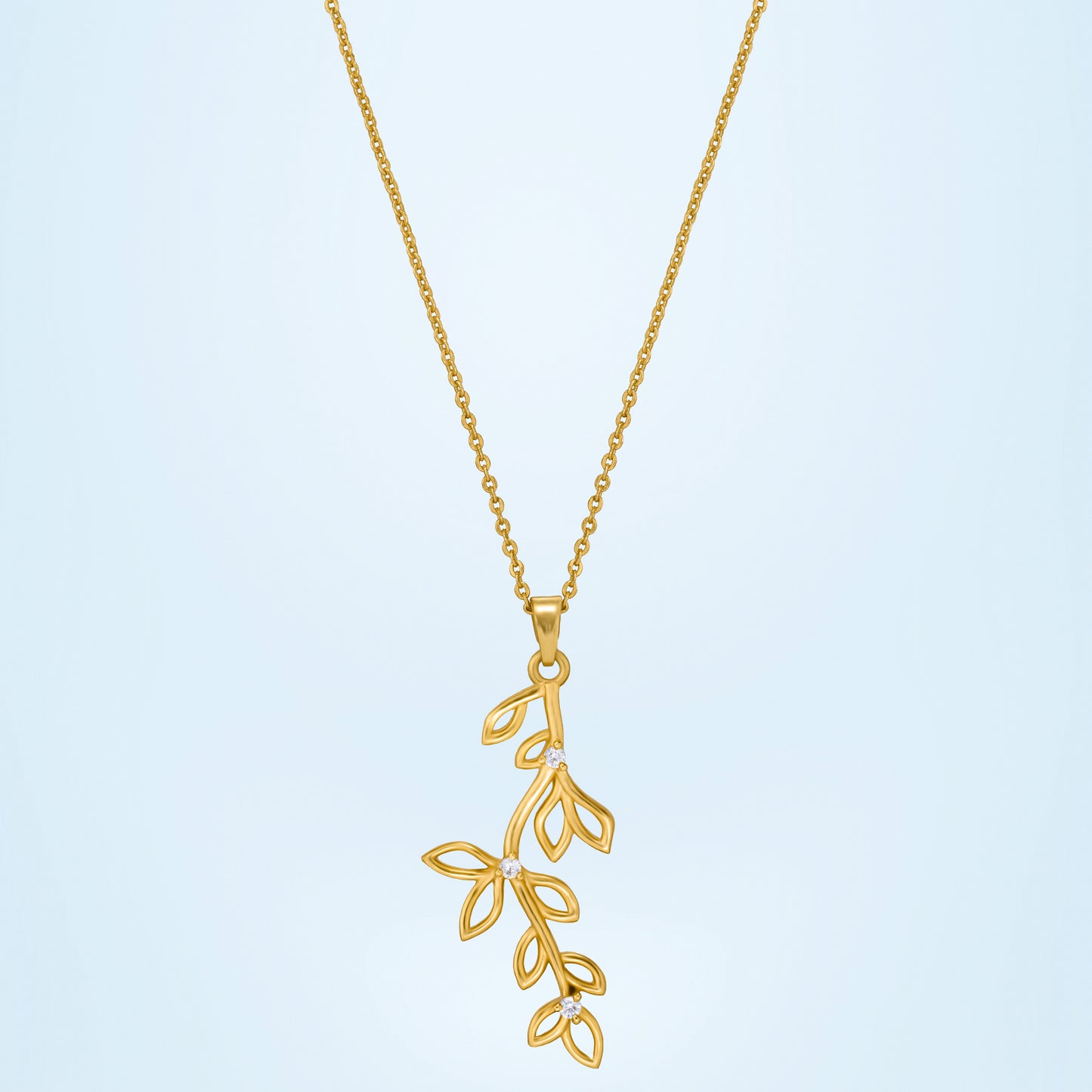 golden necklace with a leaf design on it