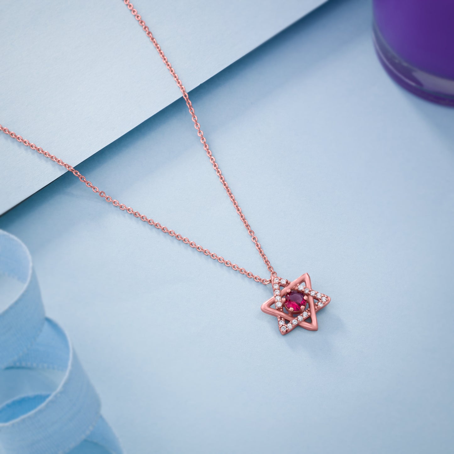 rose gold sapphire and diamond pendant with a star of david