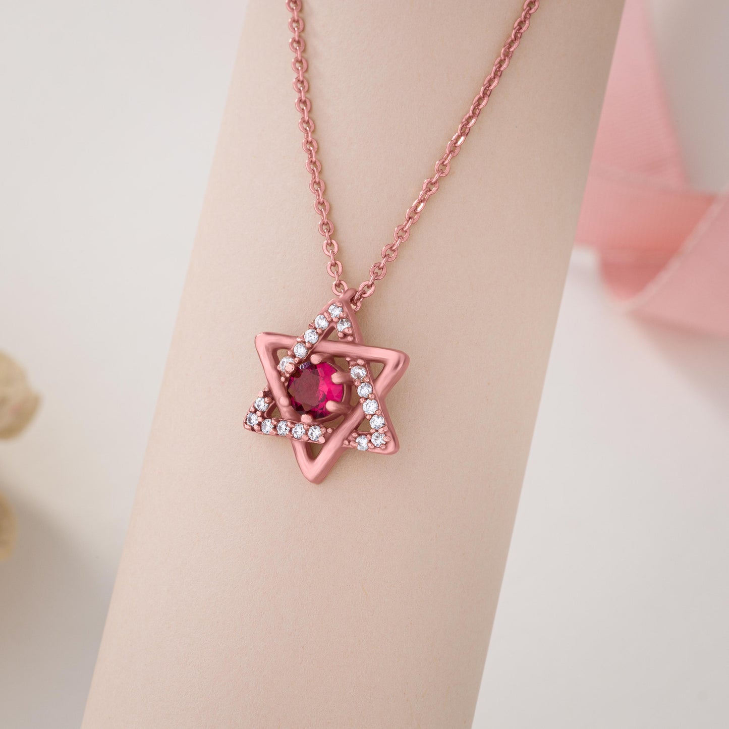 rose gold sapphire and diamond pendant with a star of david