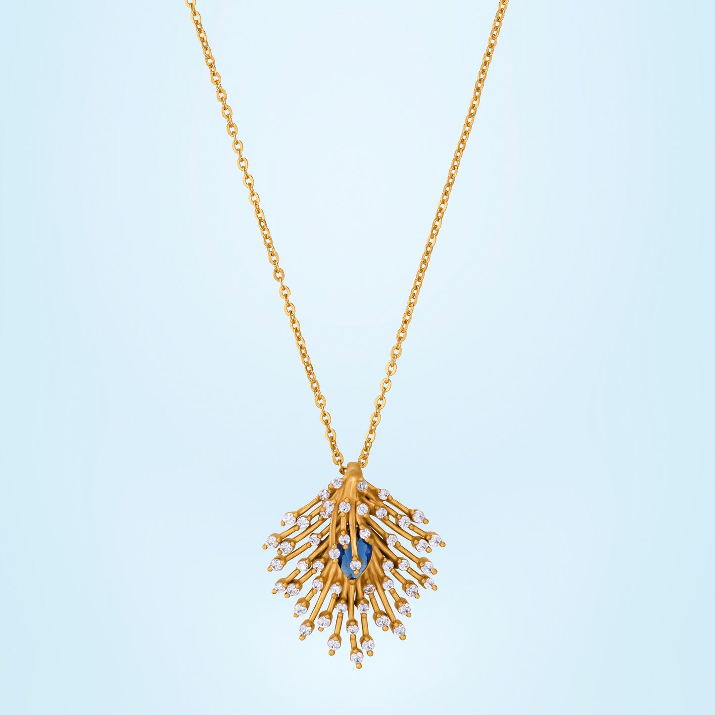 golden necklace with a blue stone pendant