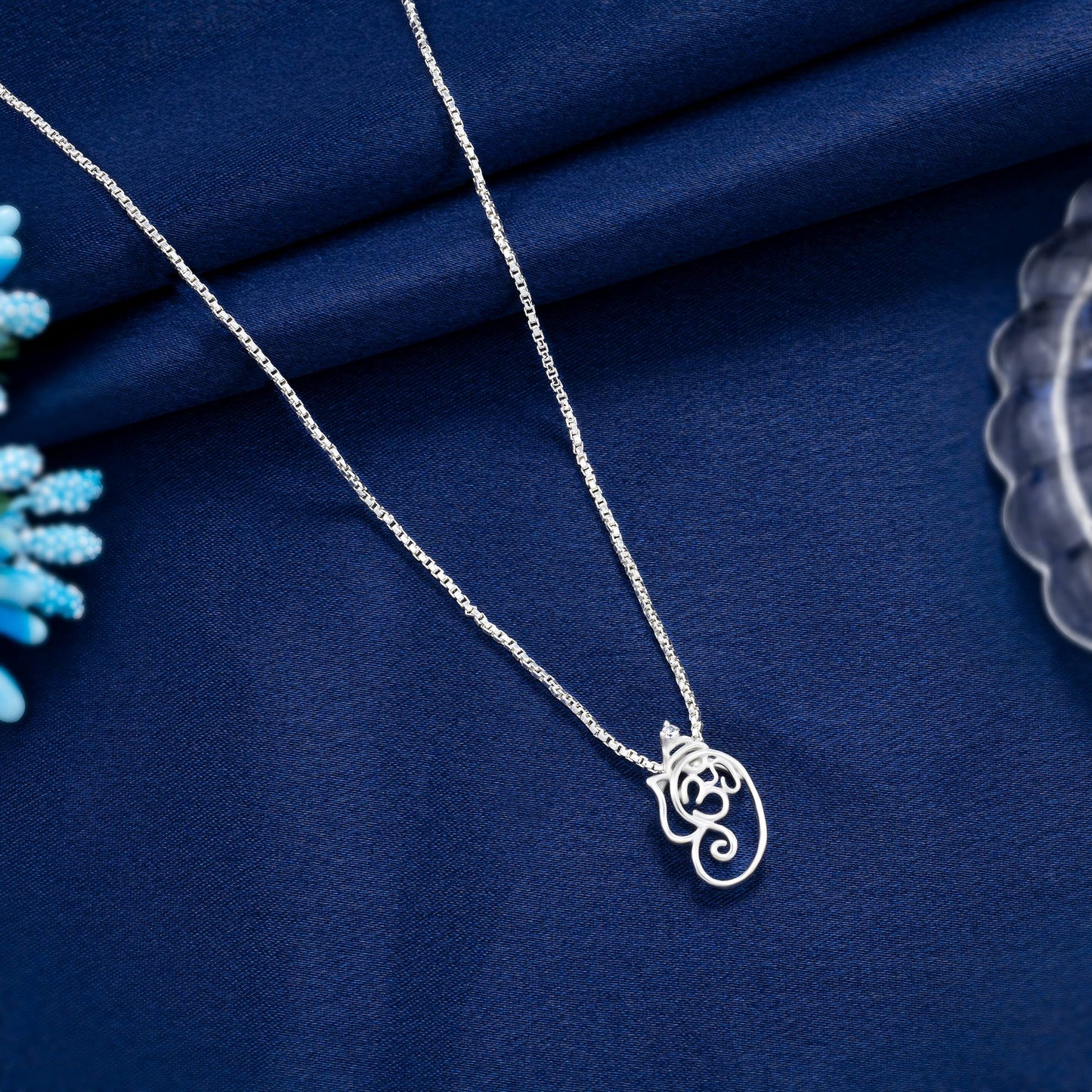 silver necklace with om pendant