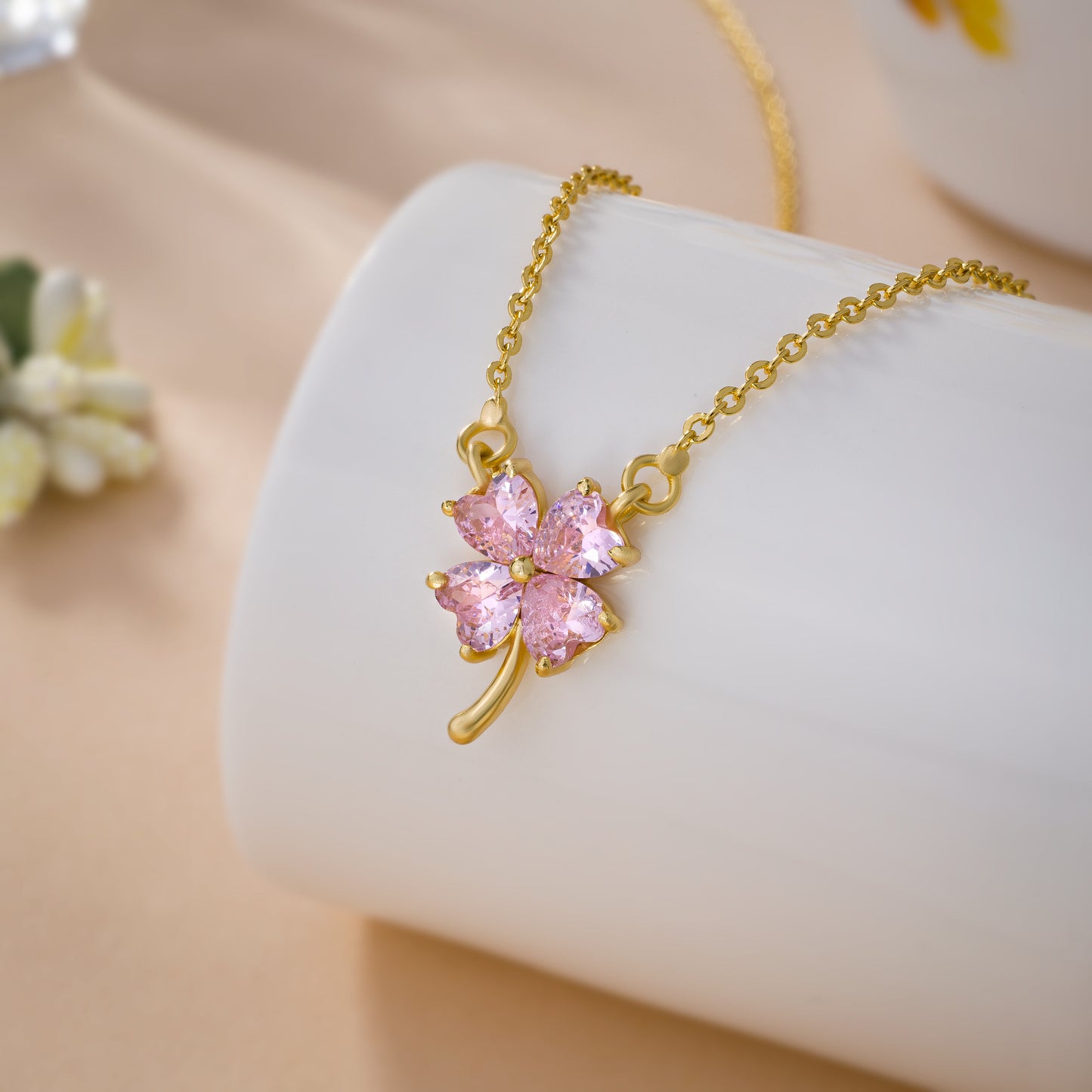 golden necklace featuring a four-leaf clover pendant