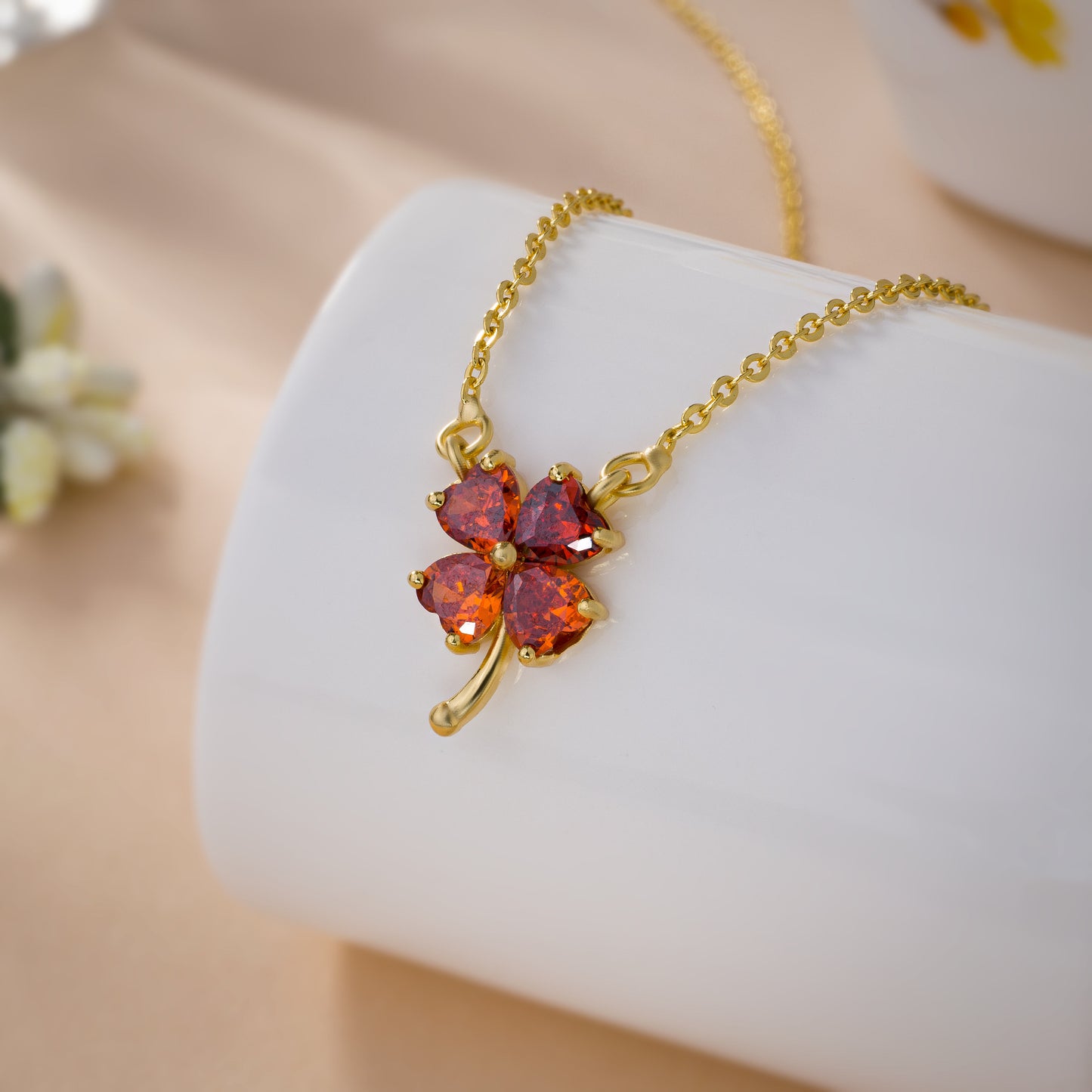 golden necklace featuring a four-leaf clover pendant