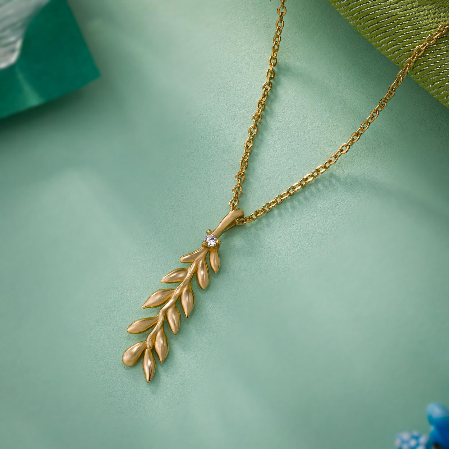 golden necklace with leaf pendant