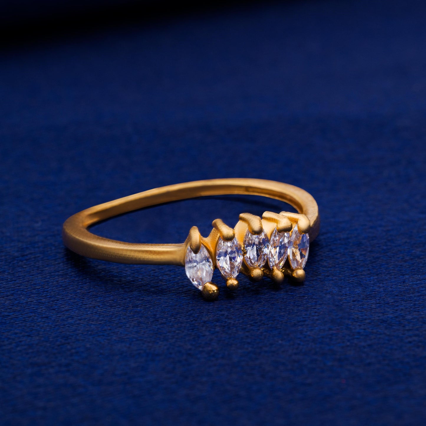 golden ring with white stones