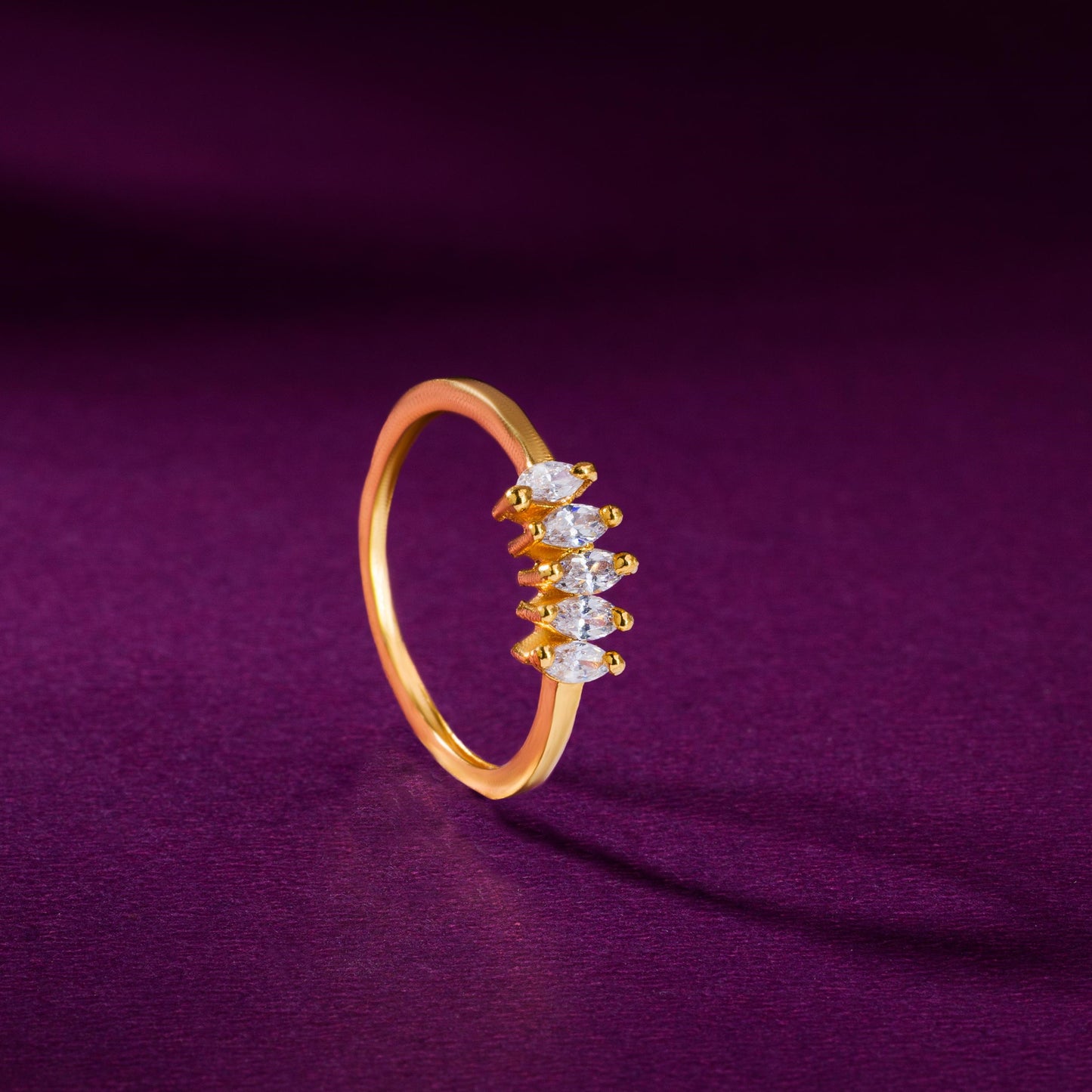 golden ring with white stones