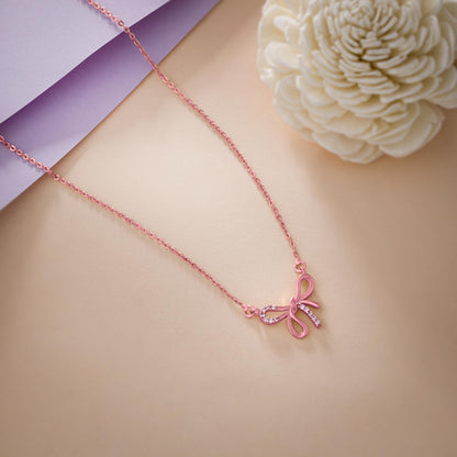 Rose Gold Necklace with a Bow on it