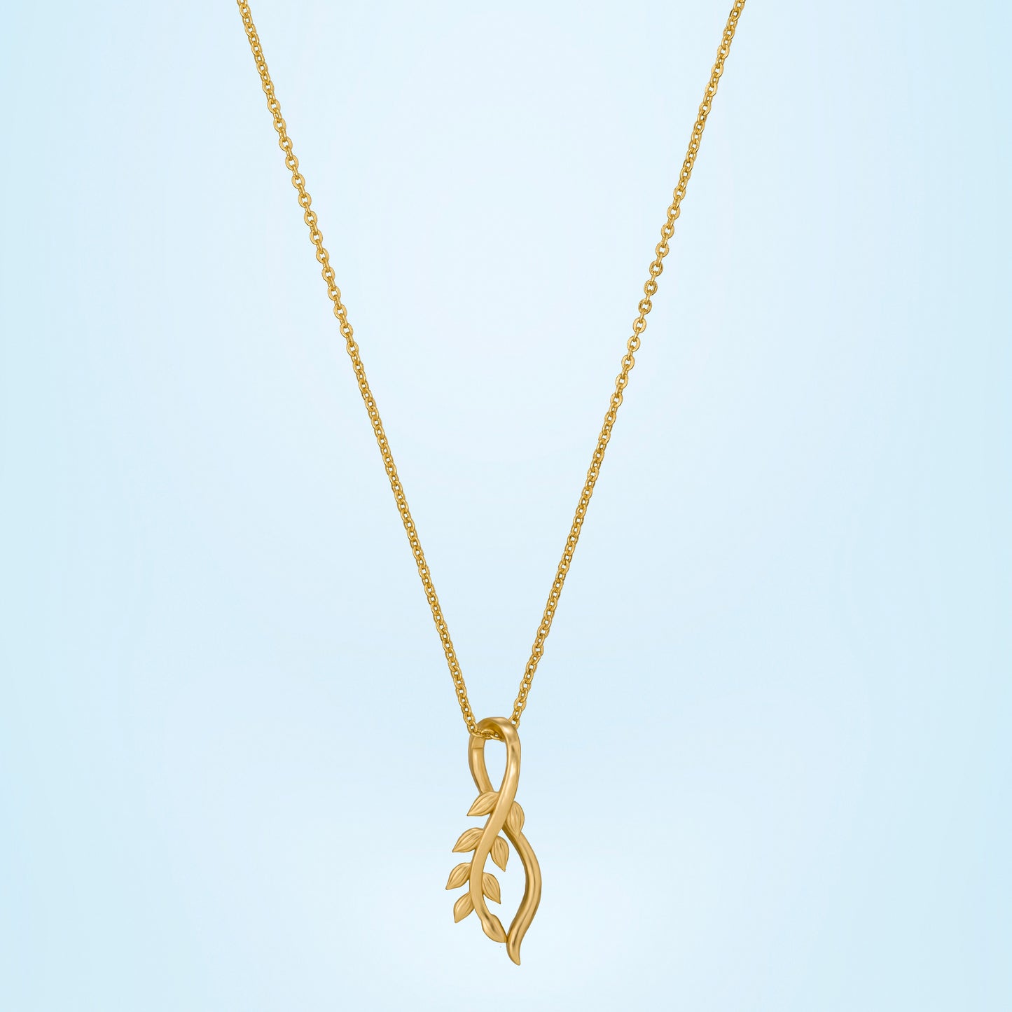 golden necklace with a small leaf on it