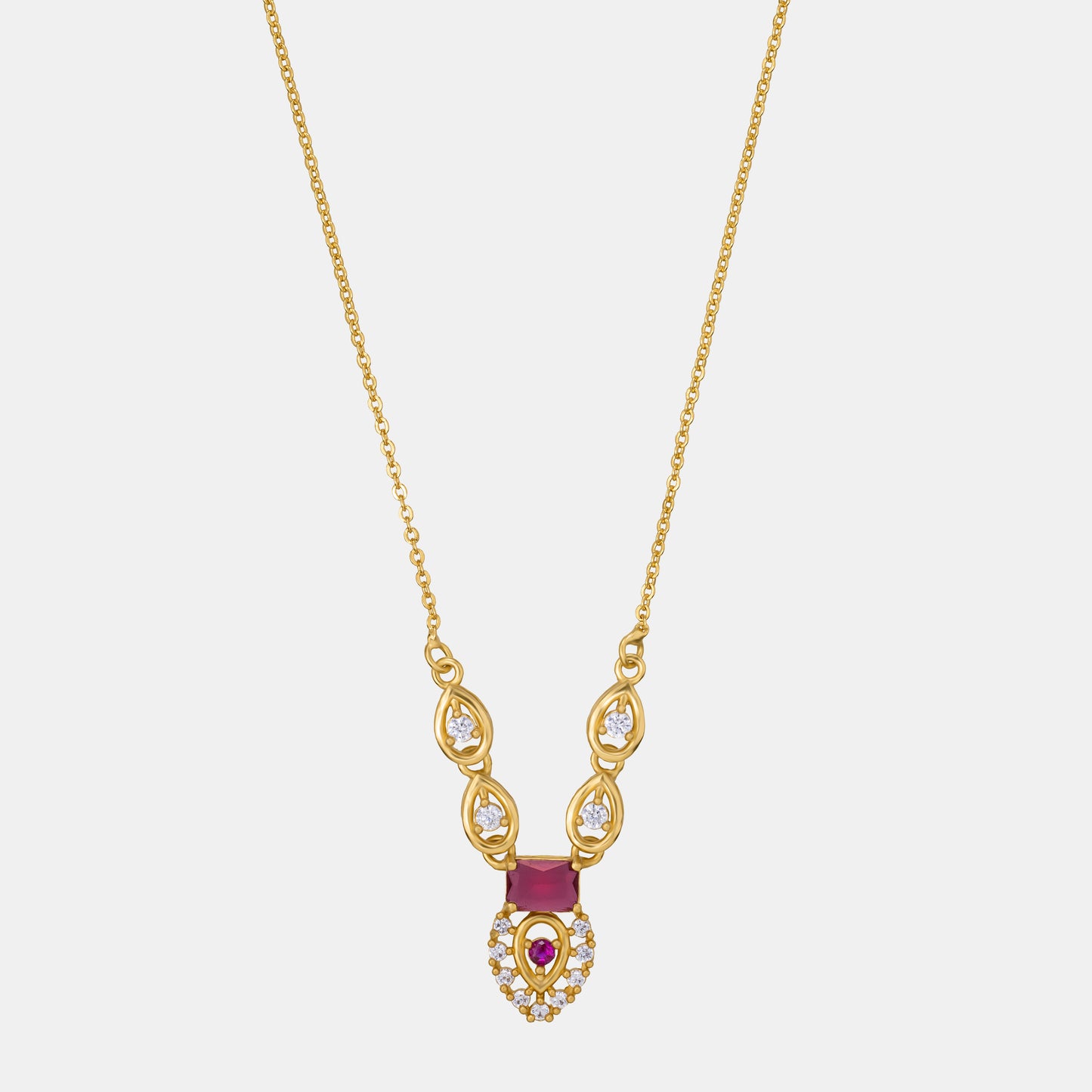 golden necklace with a ruby stone and diamonds