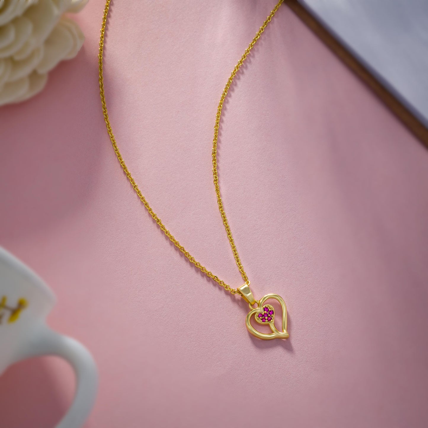 golden necklace with heart pendant