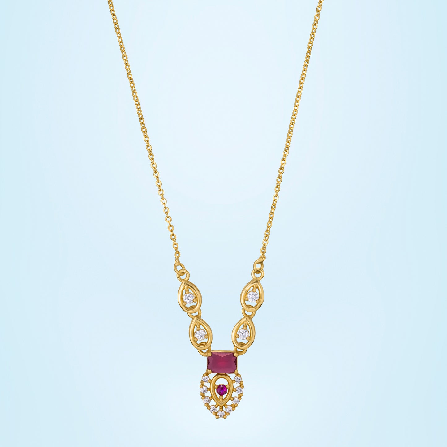 golden necklace with a ruby stone and diamonds