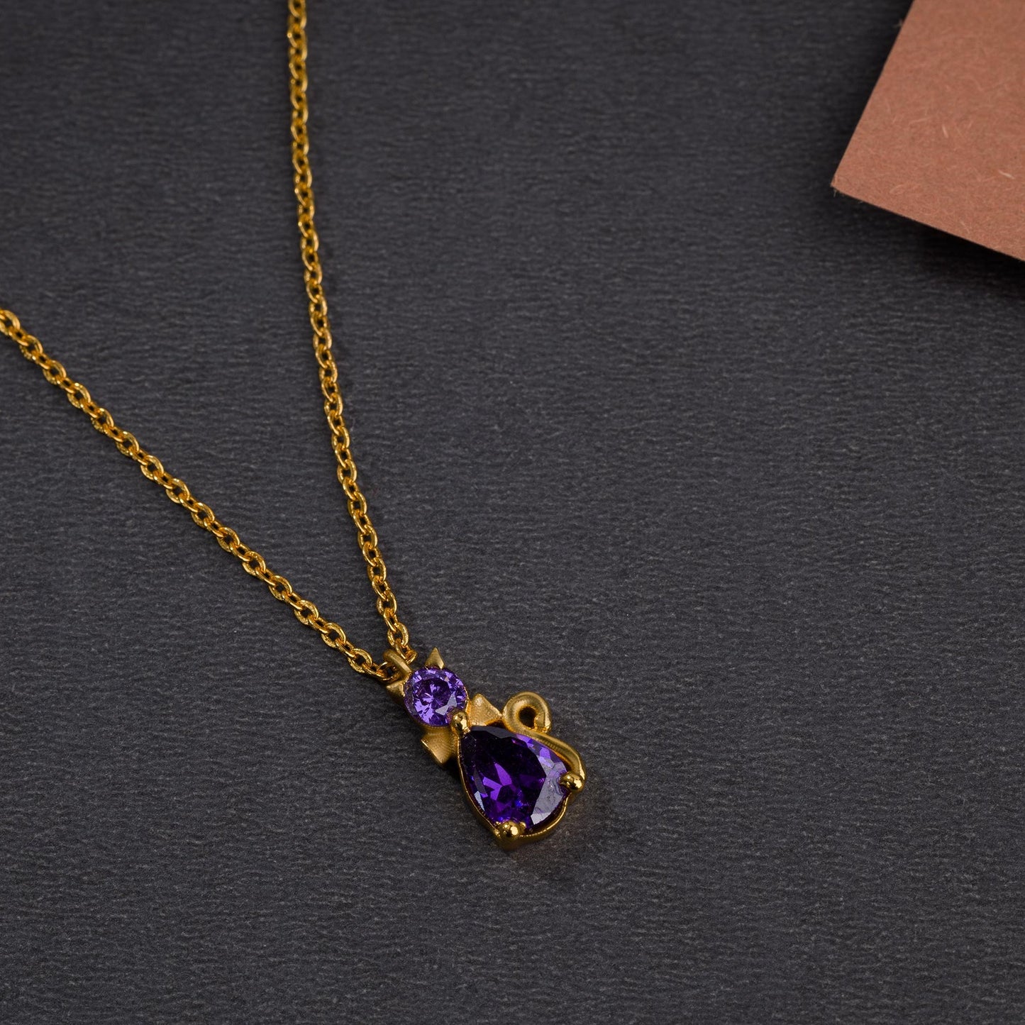 cat necklace with a golden chain