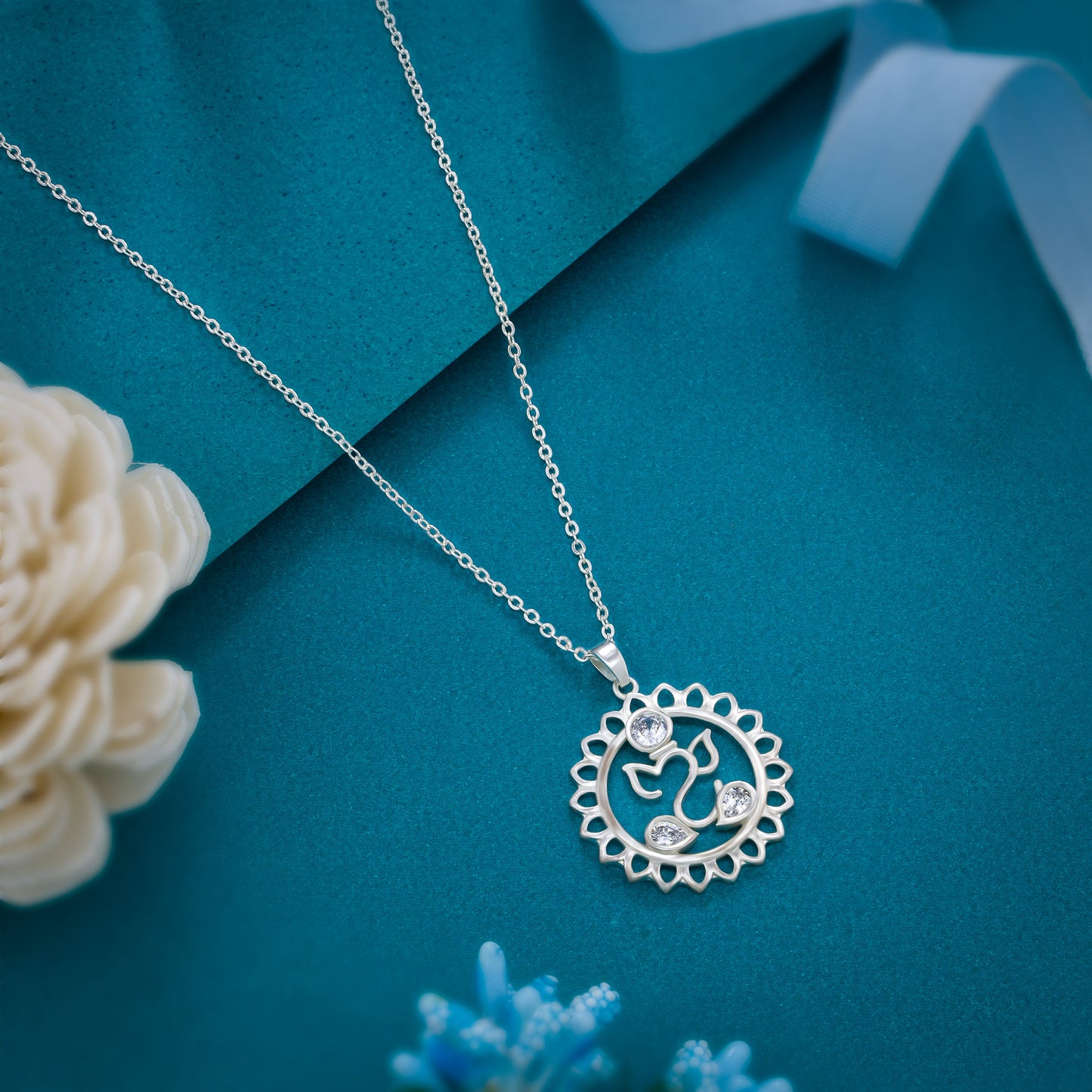 silver necklace with a diamond flower