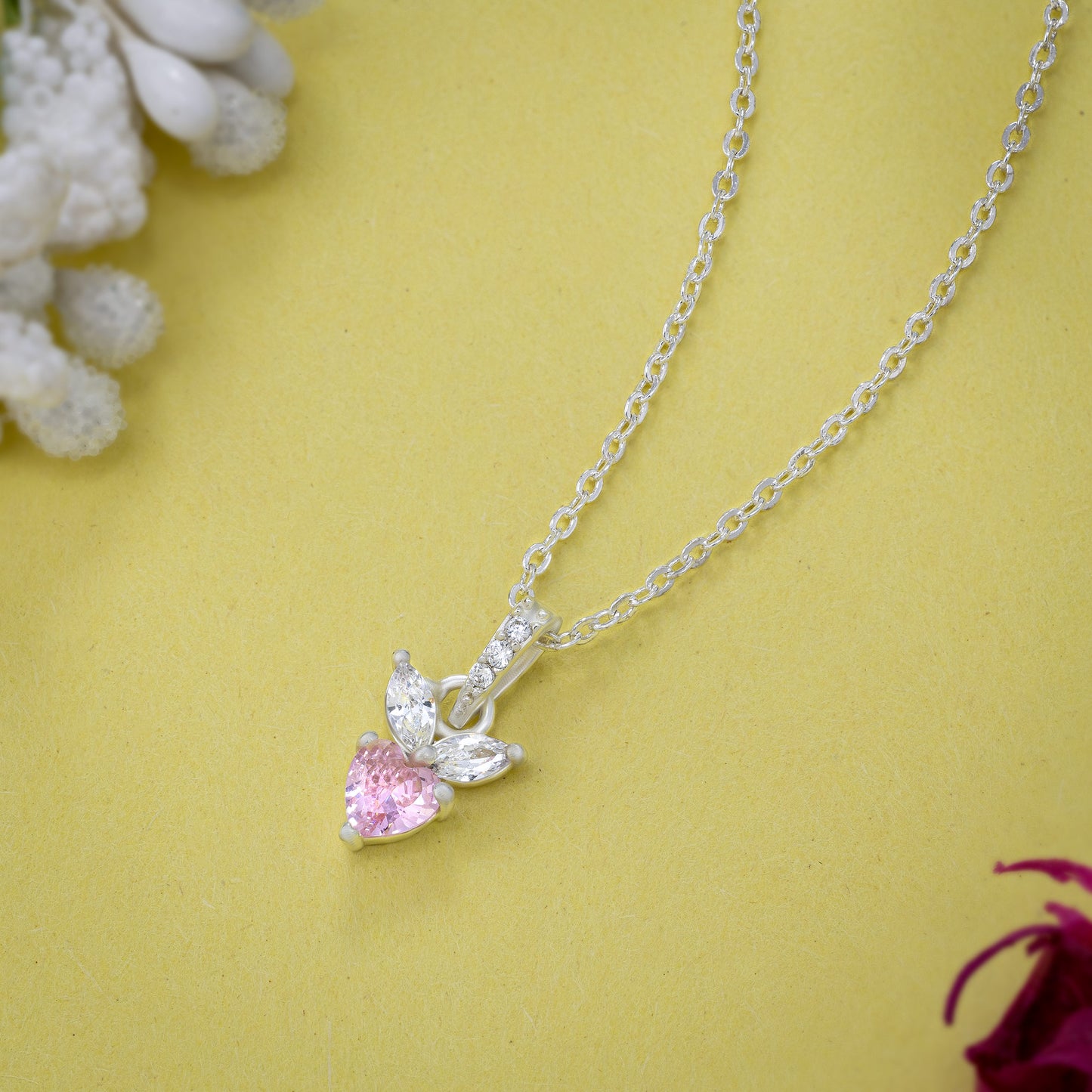 pink diamond pendant on a sleek silver chain