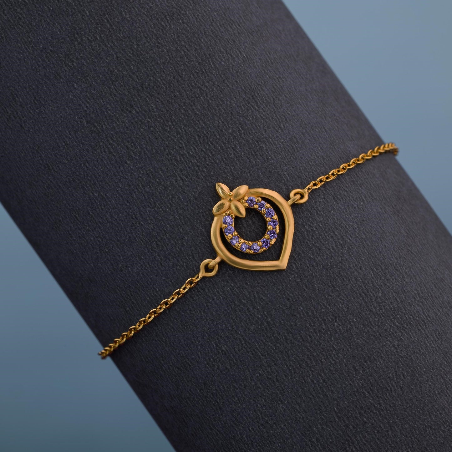 golden bracelet with a heart charm