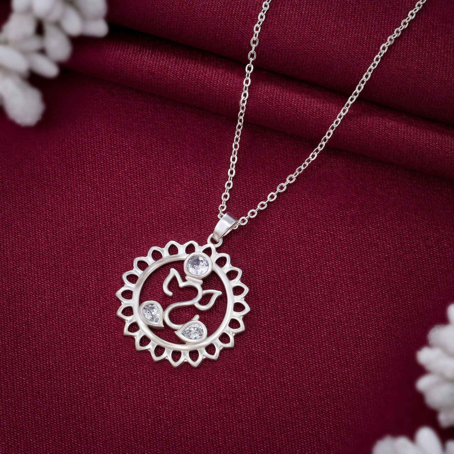 silver necklace with a diamond flower