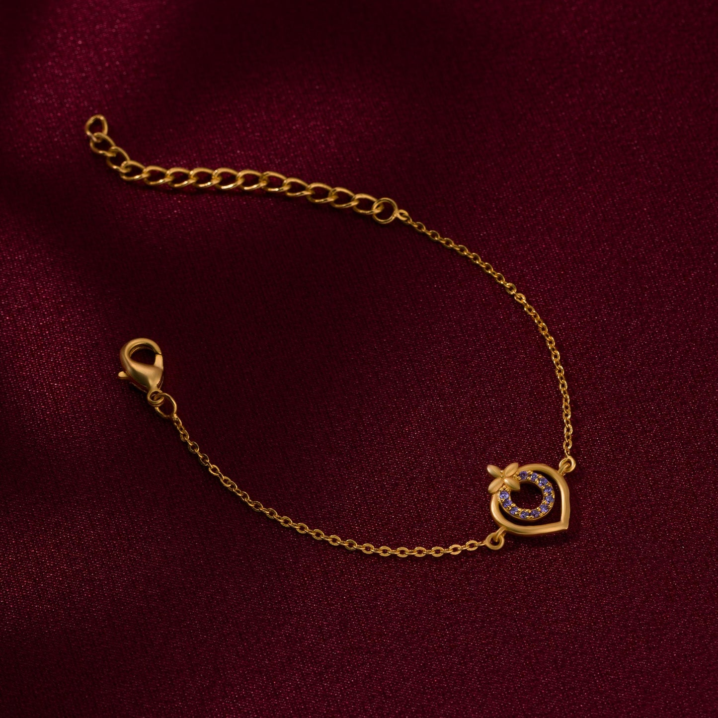 golden bracelet with a heart charm