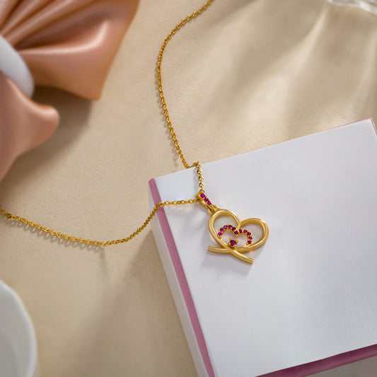 Golden Heart Necklace Adorned with Pink Stones