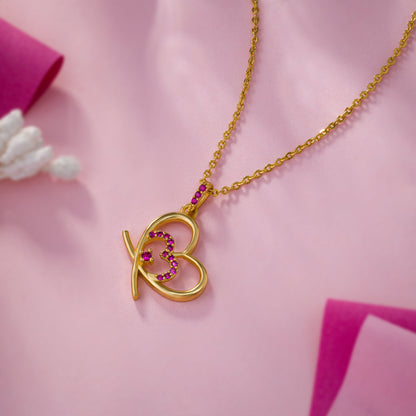 Golden Heart Necklace Adorned with Pink Stones