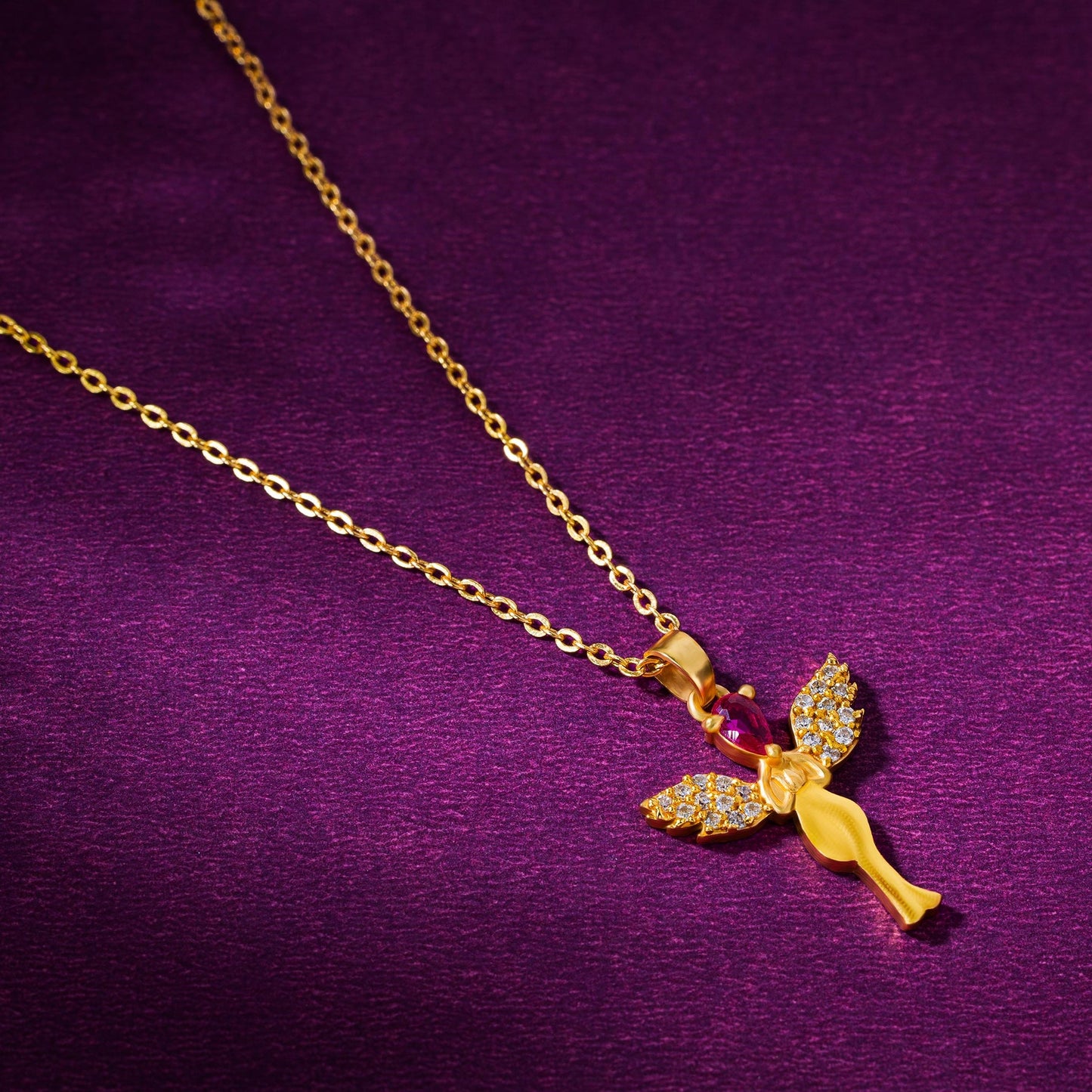 golden necklace with a purple stone angel