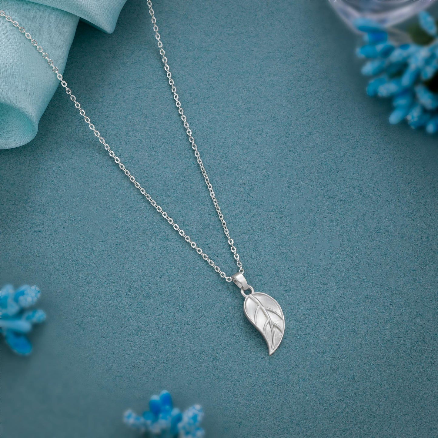 silver necklace with leaf pendant