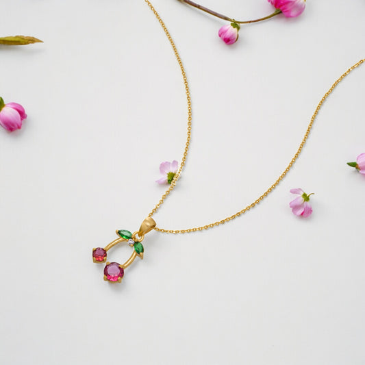 Golden Necklace with a Ruby and Emerald Stone