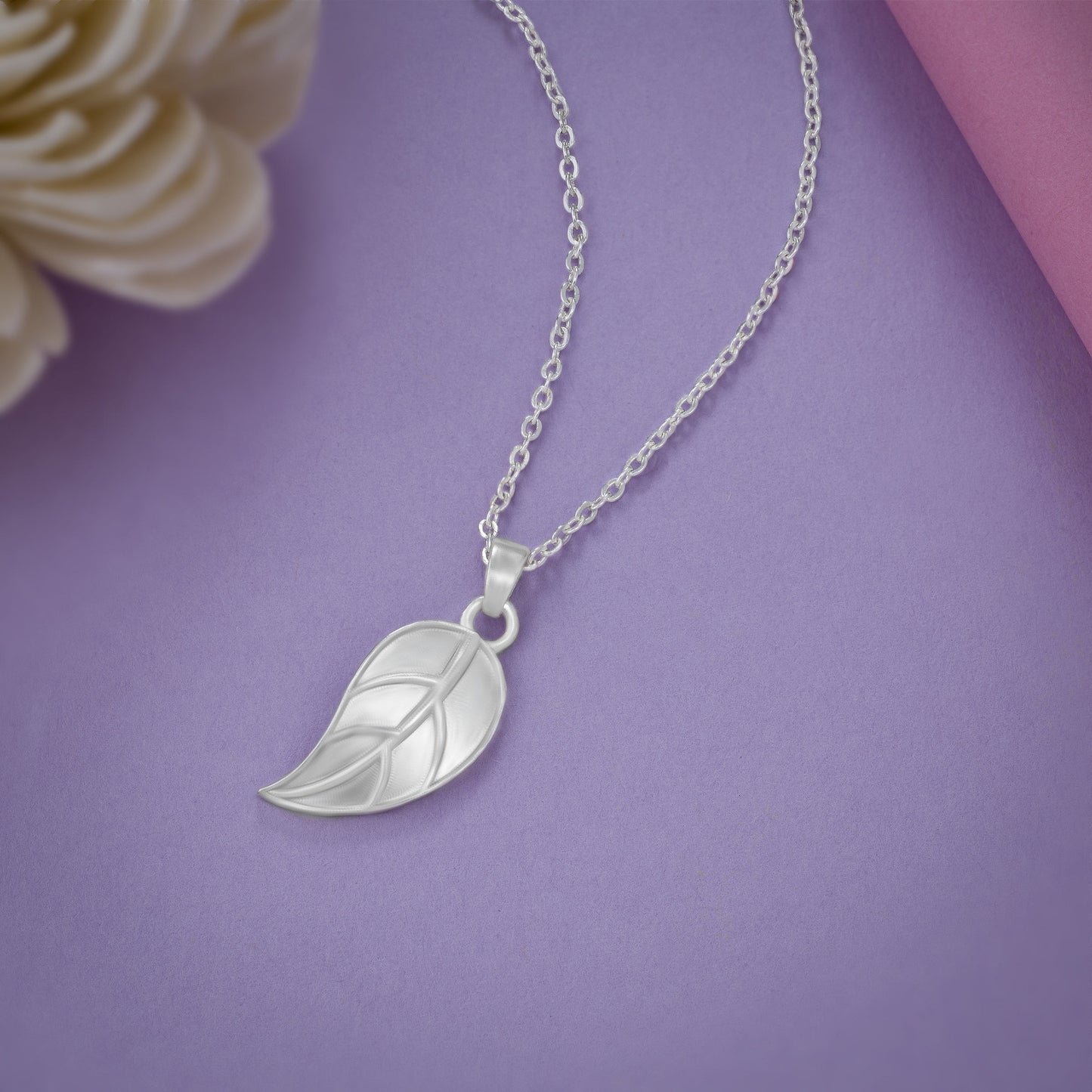 silver necklace with leaf pendant