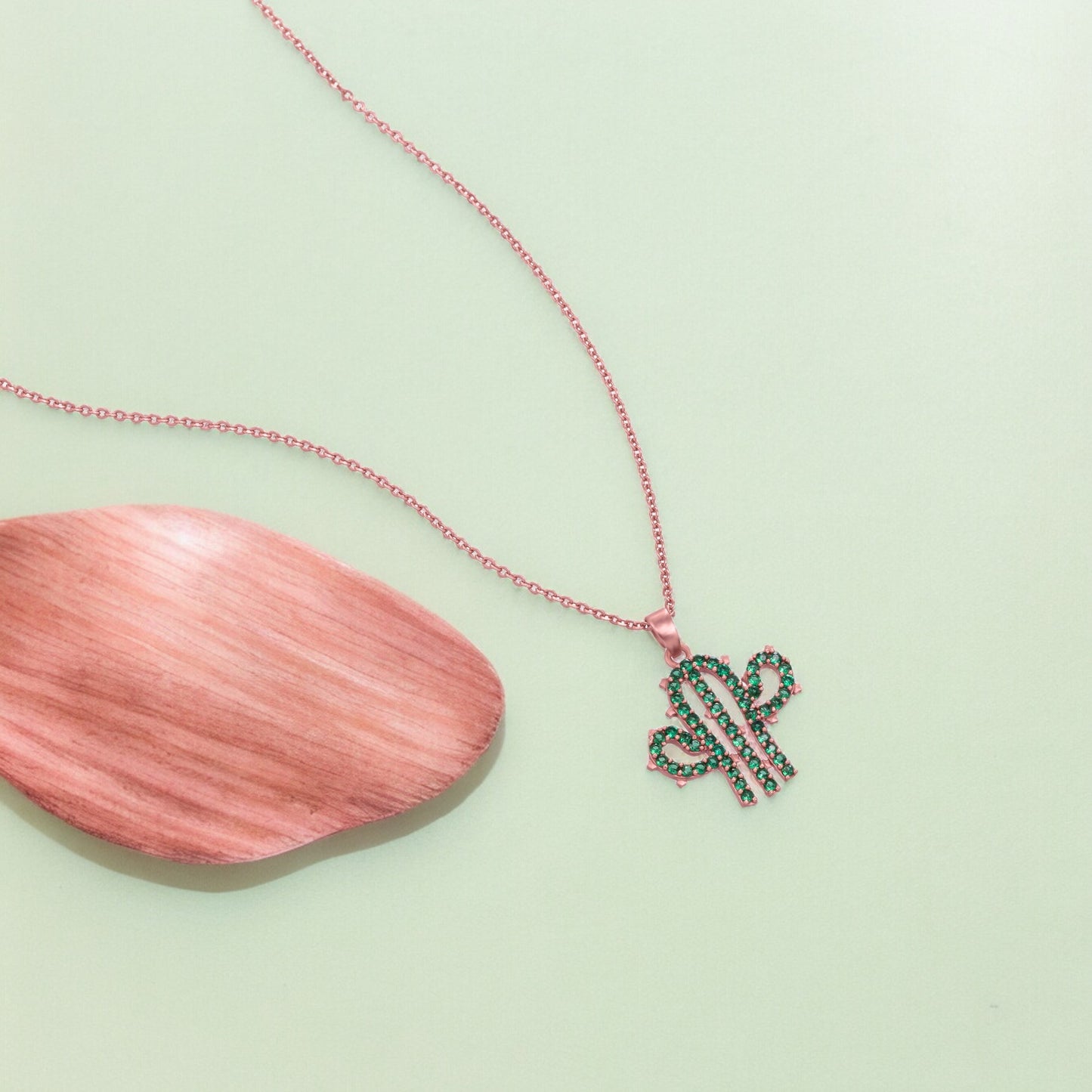 green and rose gold necklace with a cactus charm