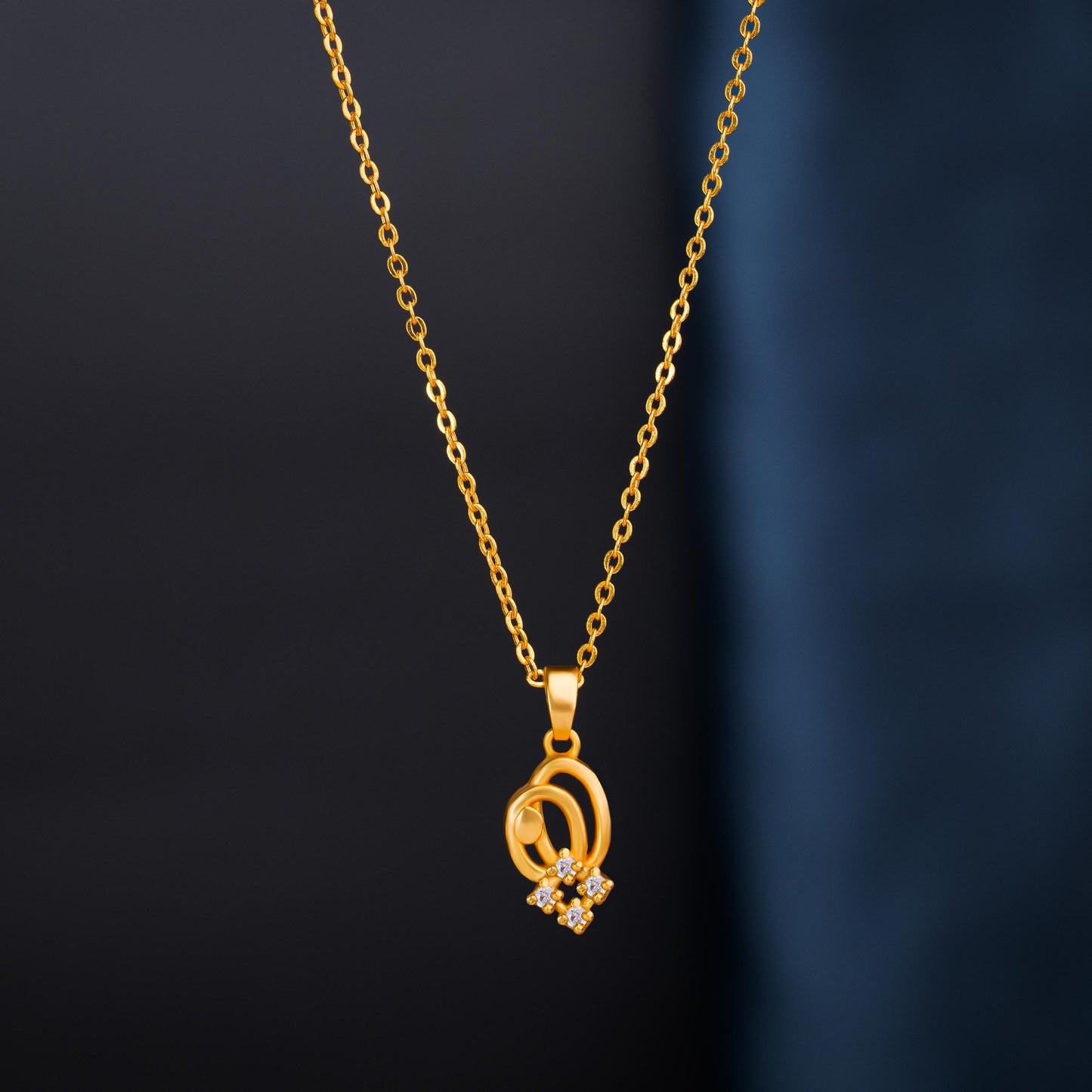 golden necklace with a diamond pendant