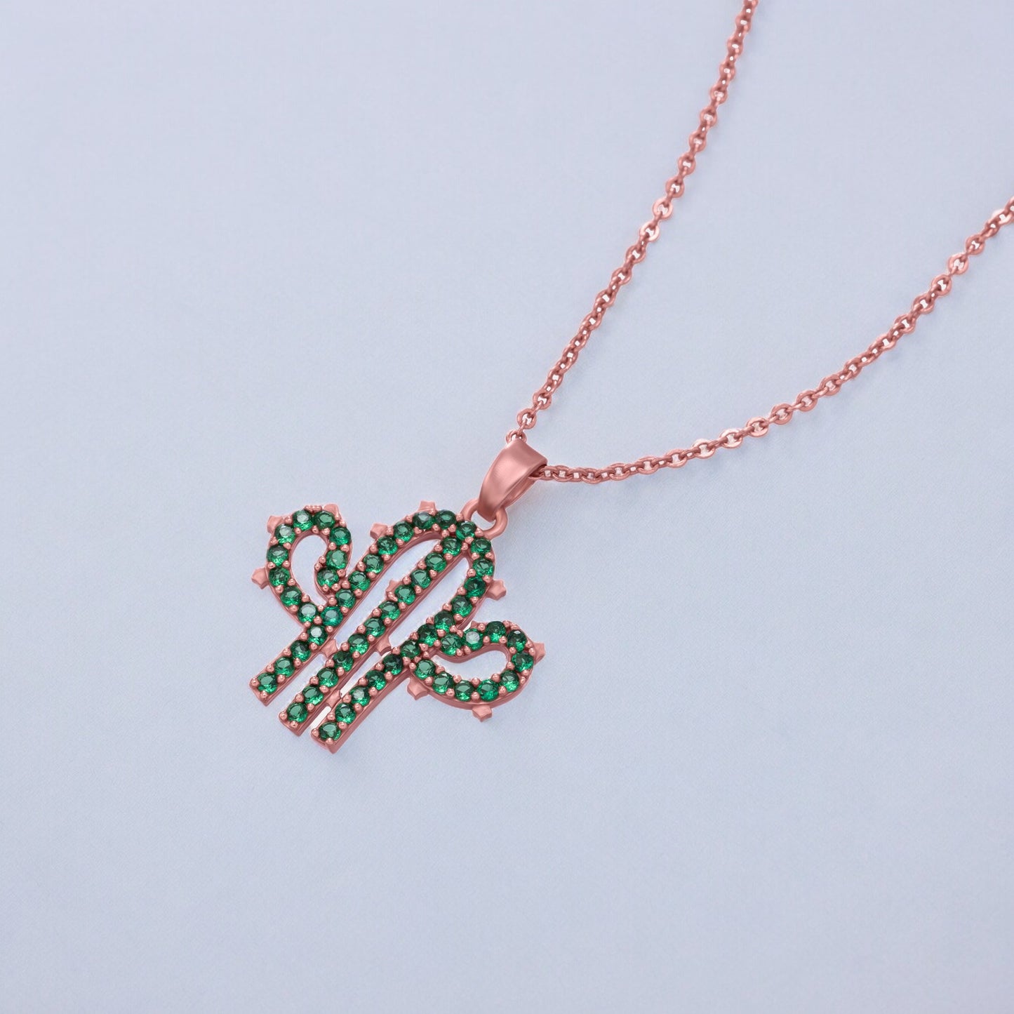 green and rose gold necklace with a cactus charm