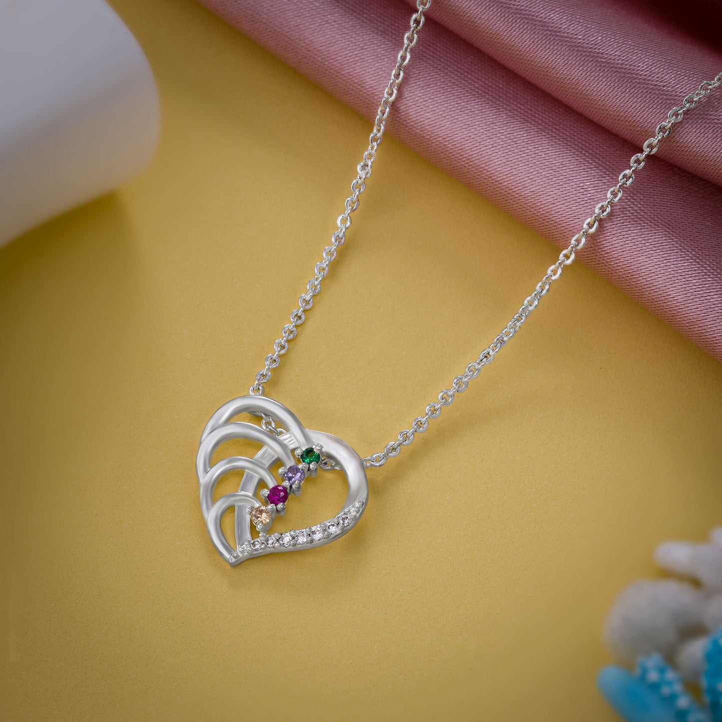 silver necklace with a diamond heart pendant