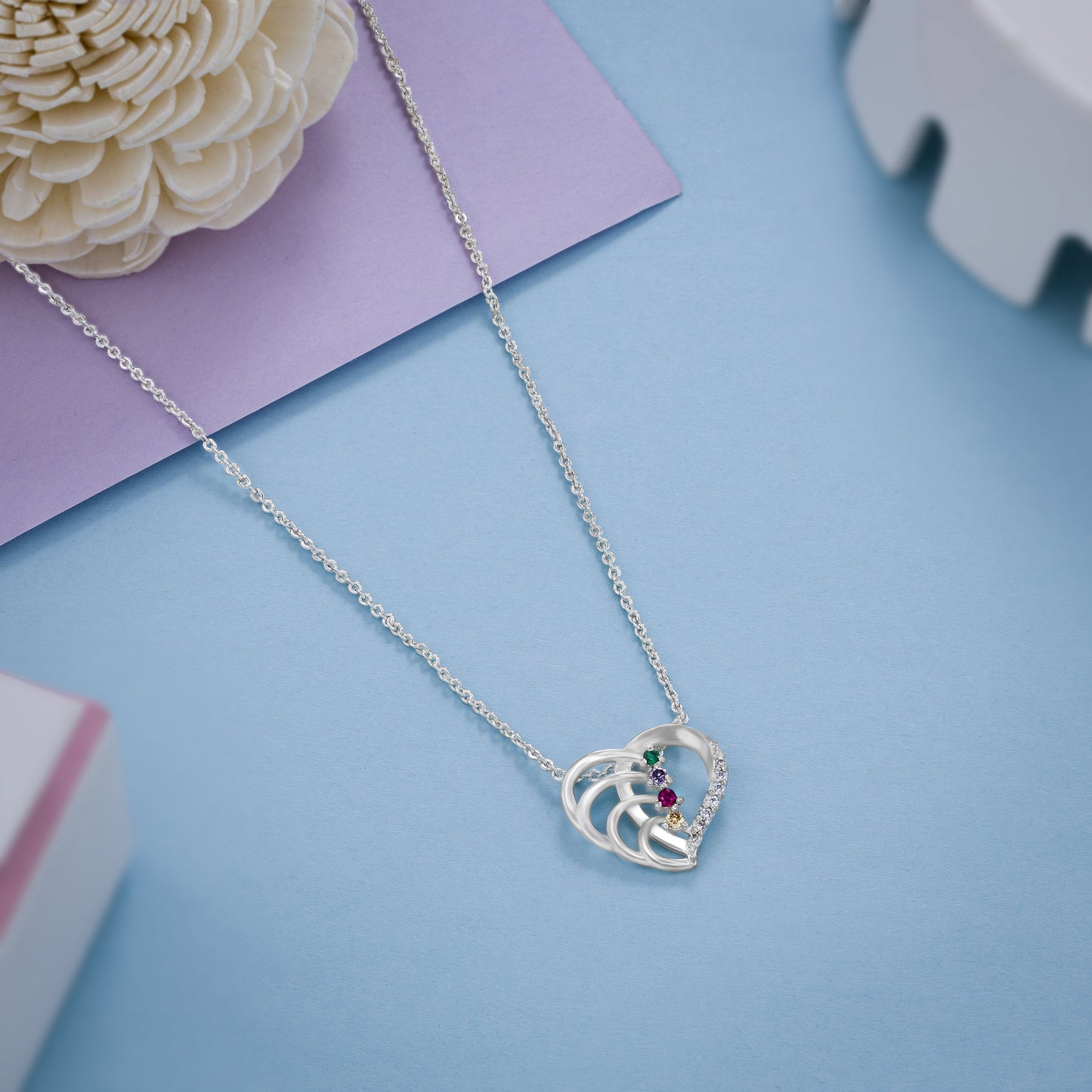 silver necklace with a diamond heart pendant