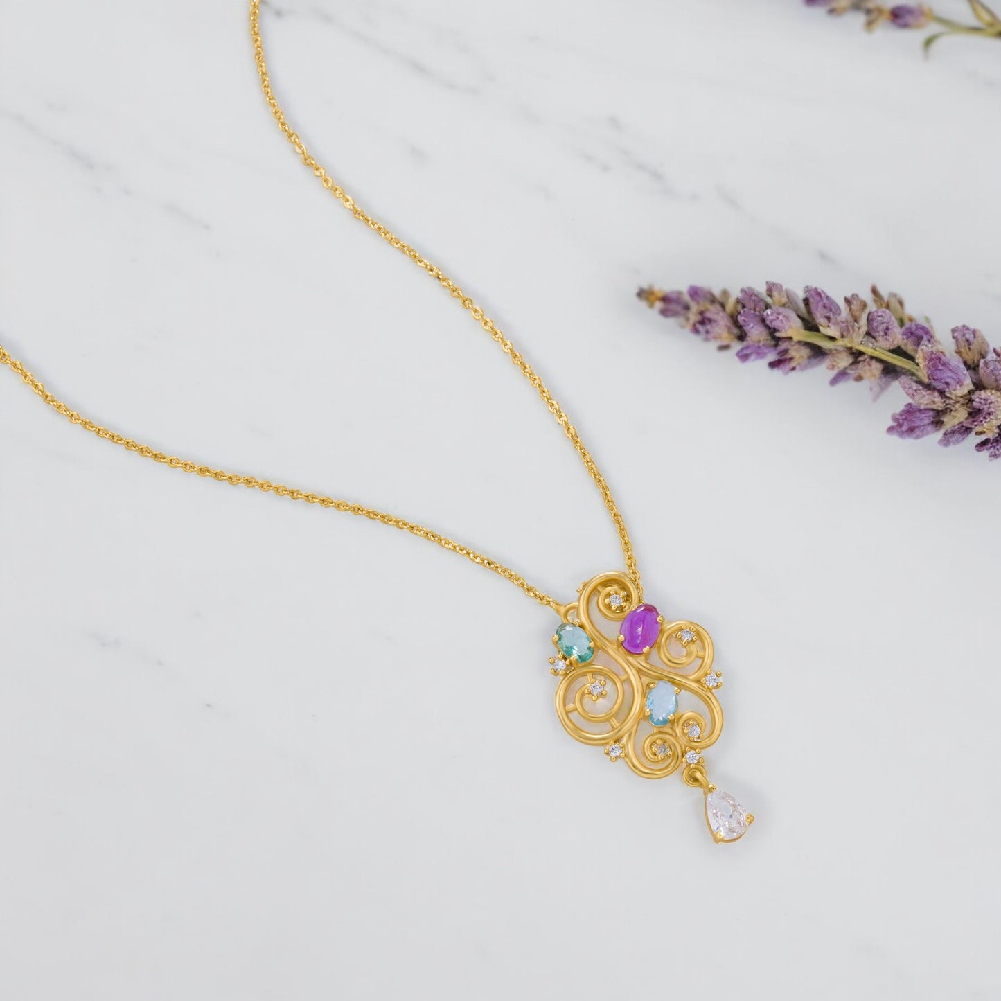 golden necklace with a purple stone and a white diamond