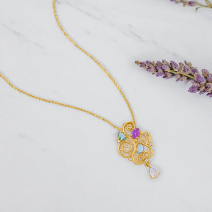 Golden Necklace with a Purple Stone and a White Diamond