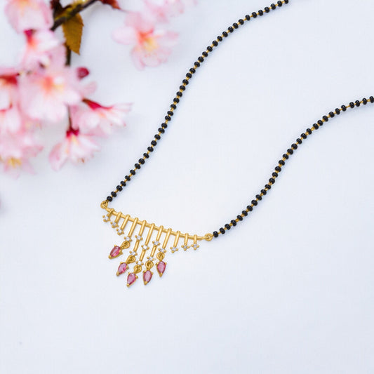 Necklace with a Pink Stone and Black Beads