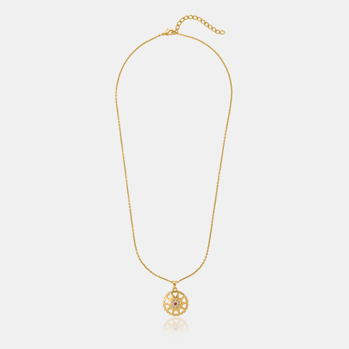 golden necklace with a flower design on it