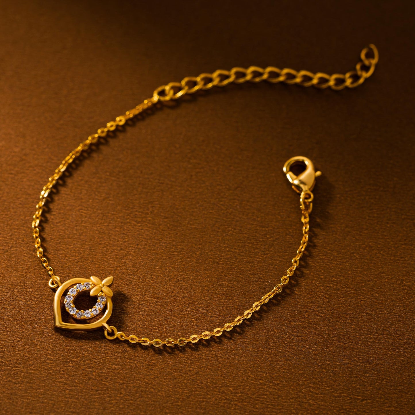 golden bracelet with a heart charm