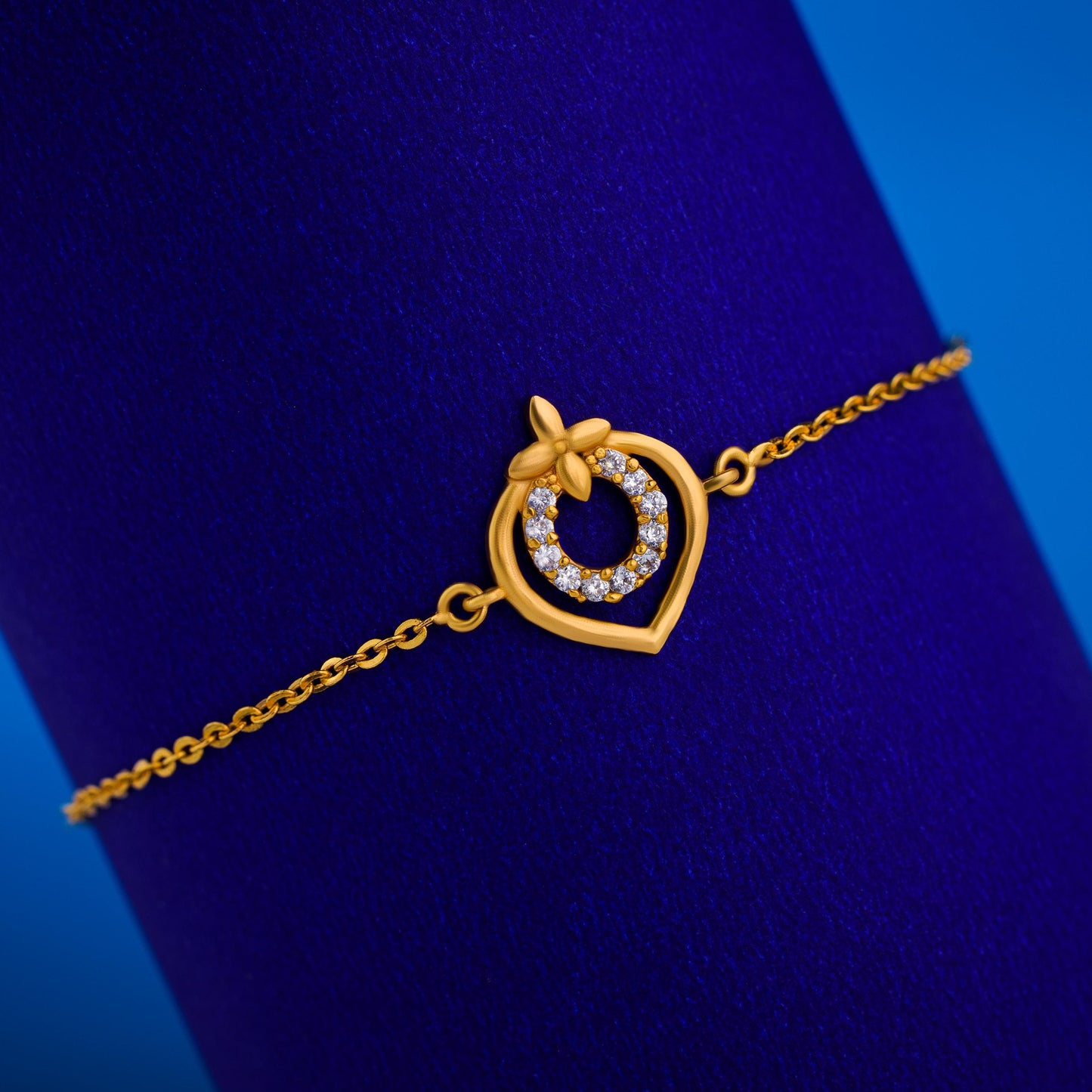 golden bracelet with a heart charm