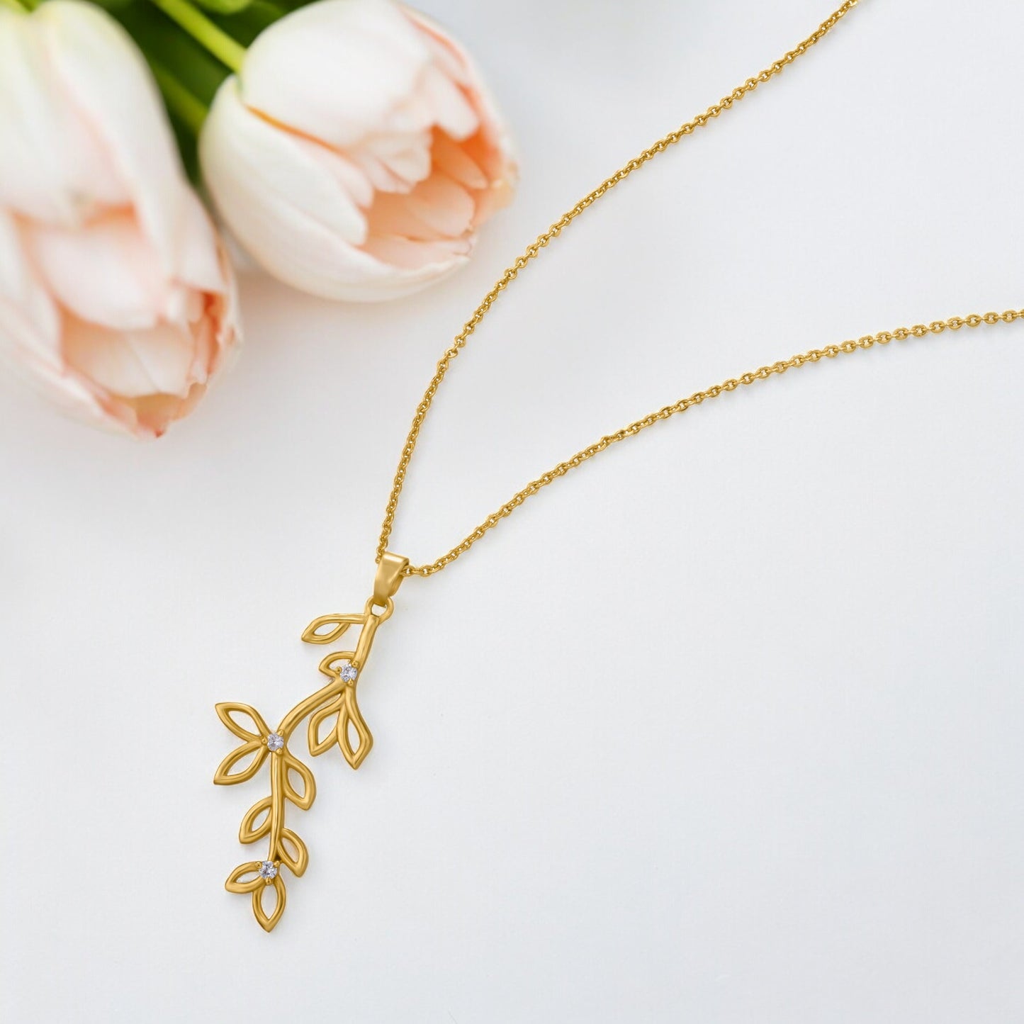 golden necklace with a leaf design on it