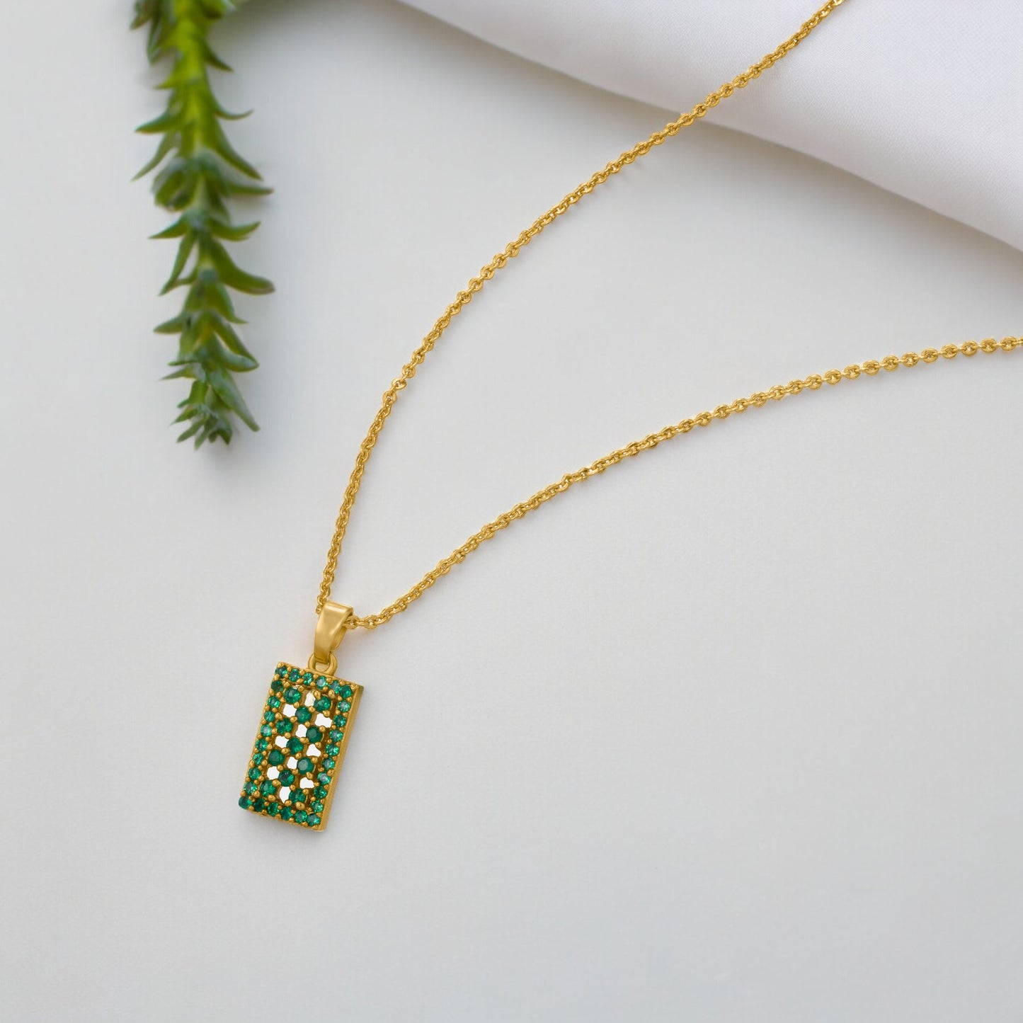 green radiant rectangle charm