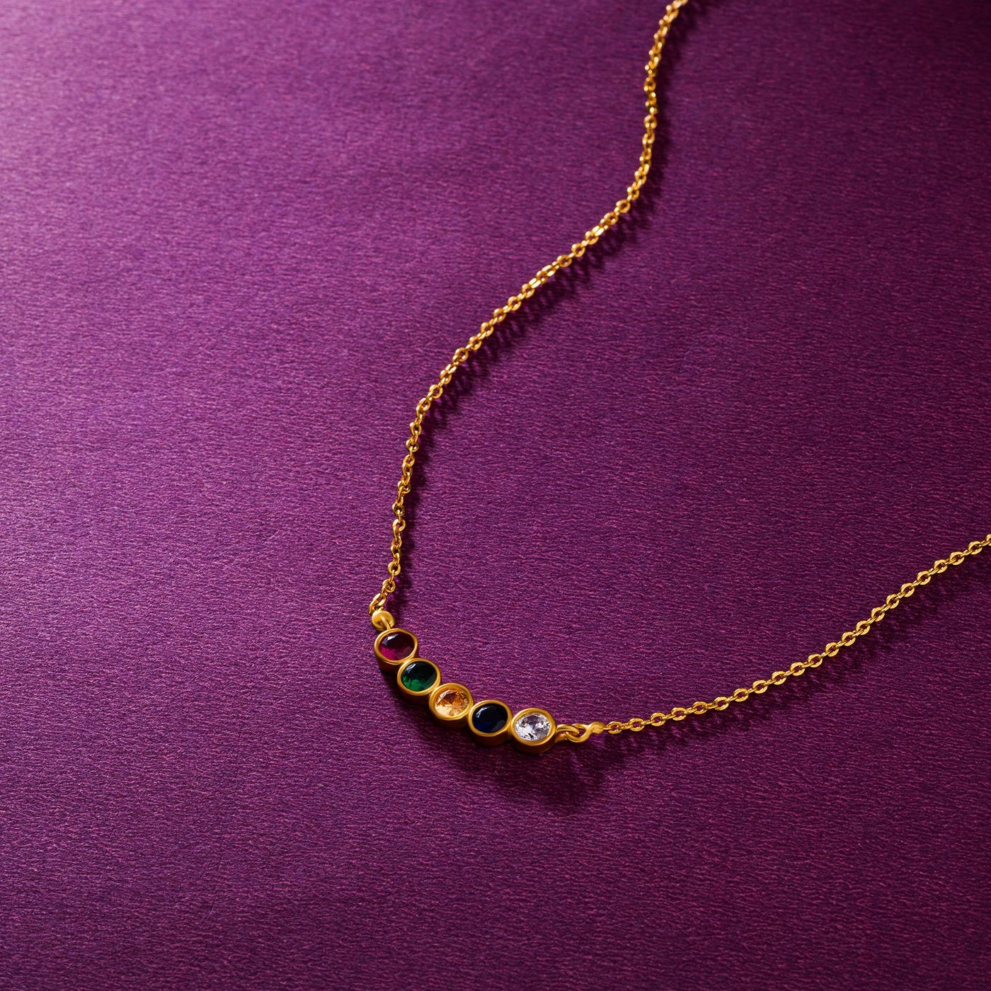 golden necklace with multicolor stones