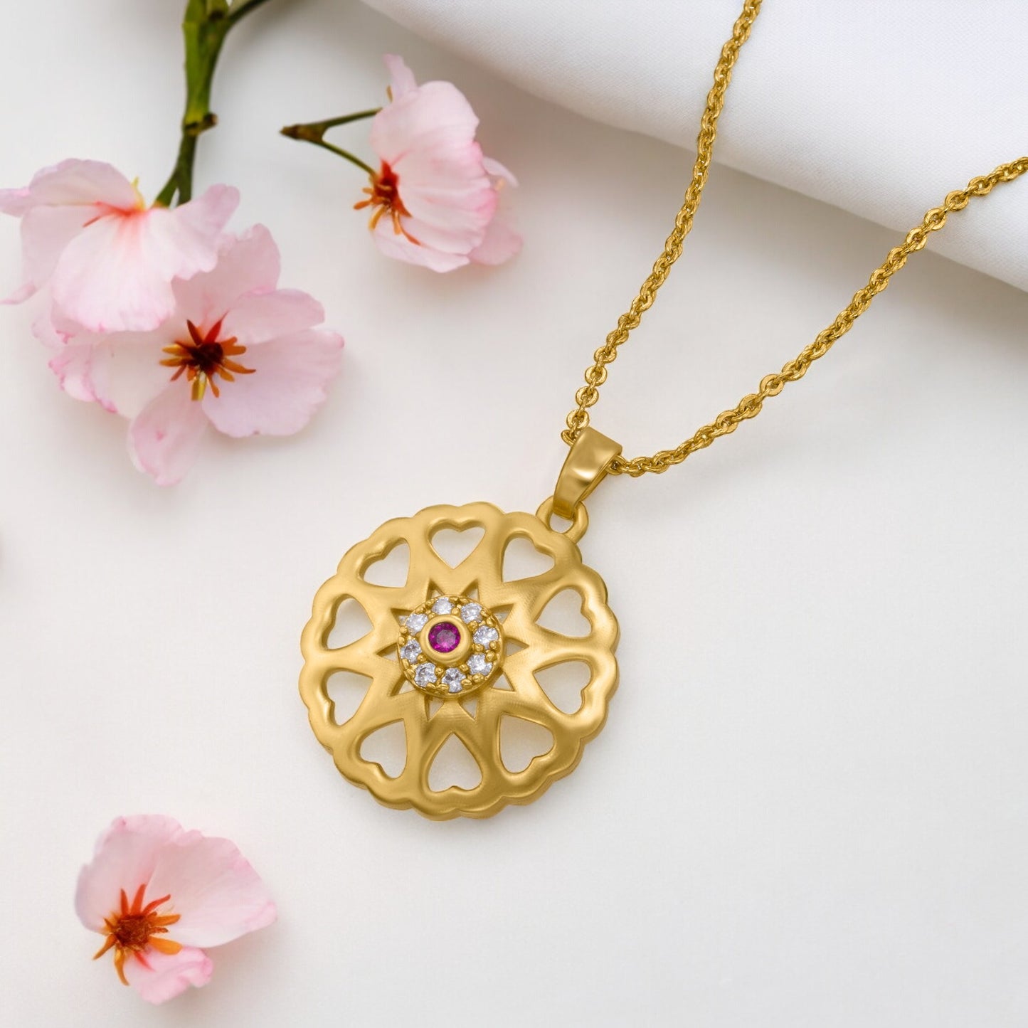 golden necklace with a flower design on it