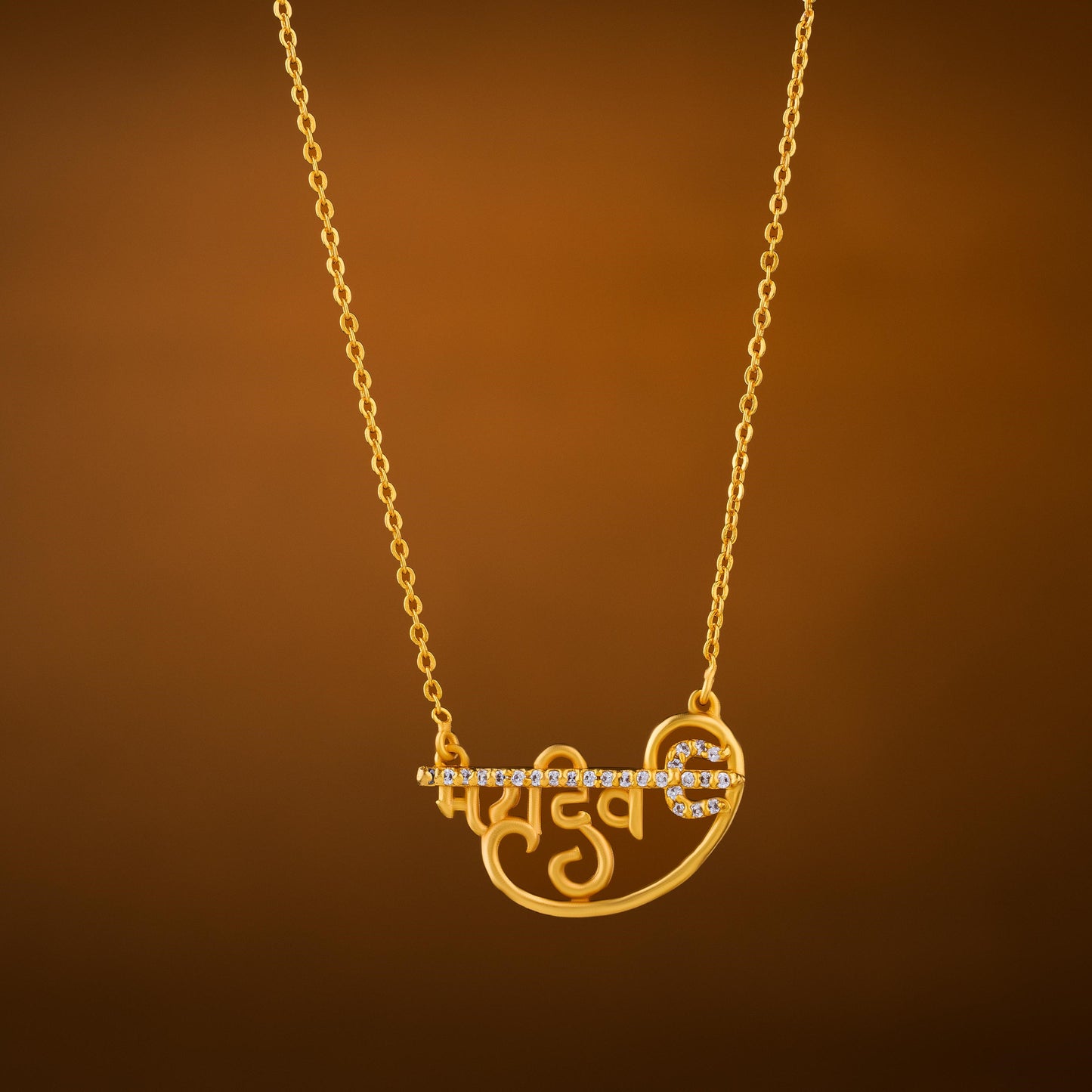 golden necklace with the mahadev