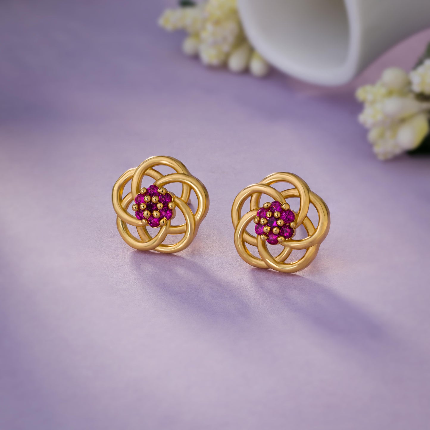 golden earrings with intricate flower