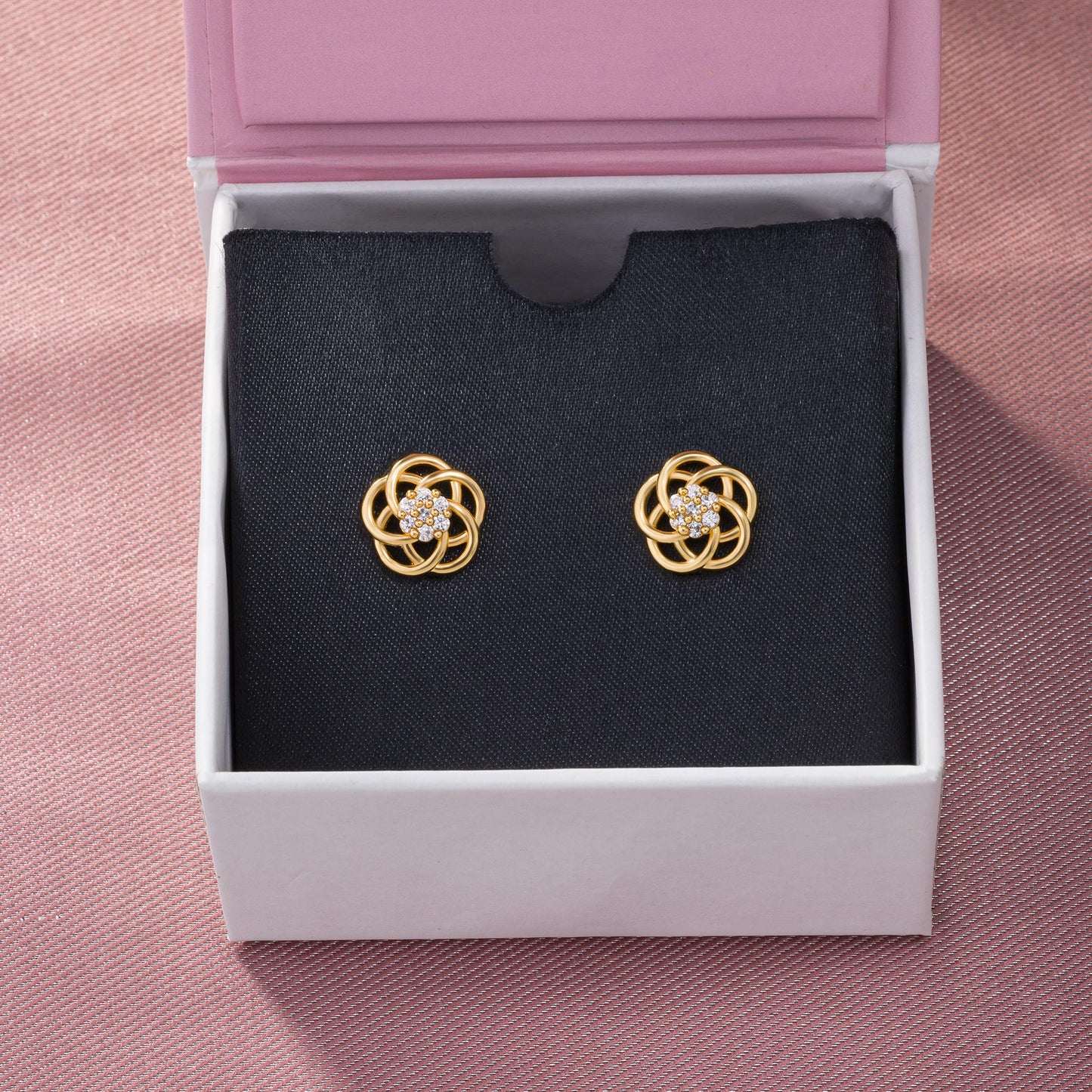 golden earrings with intricate flower