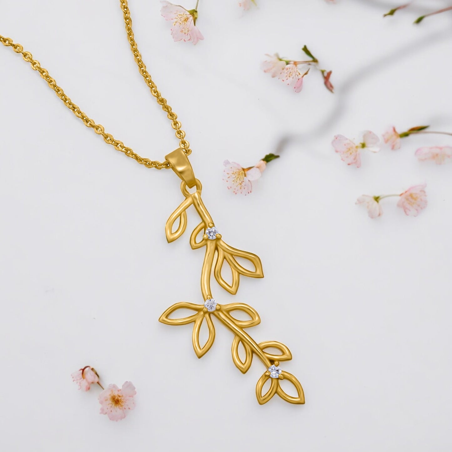 golden necklace with a leaf design on it