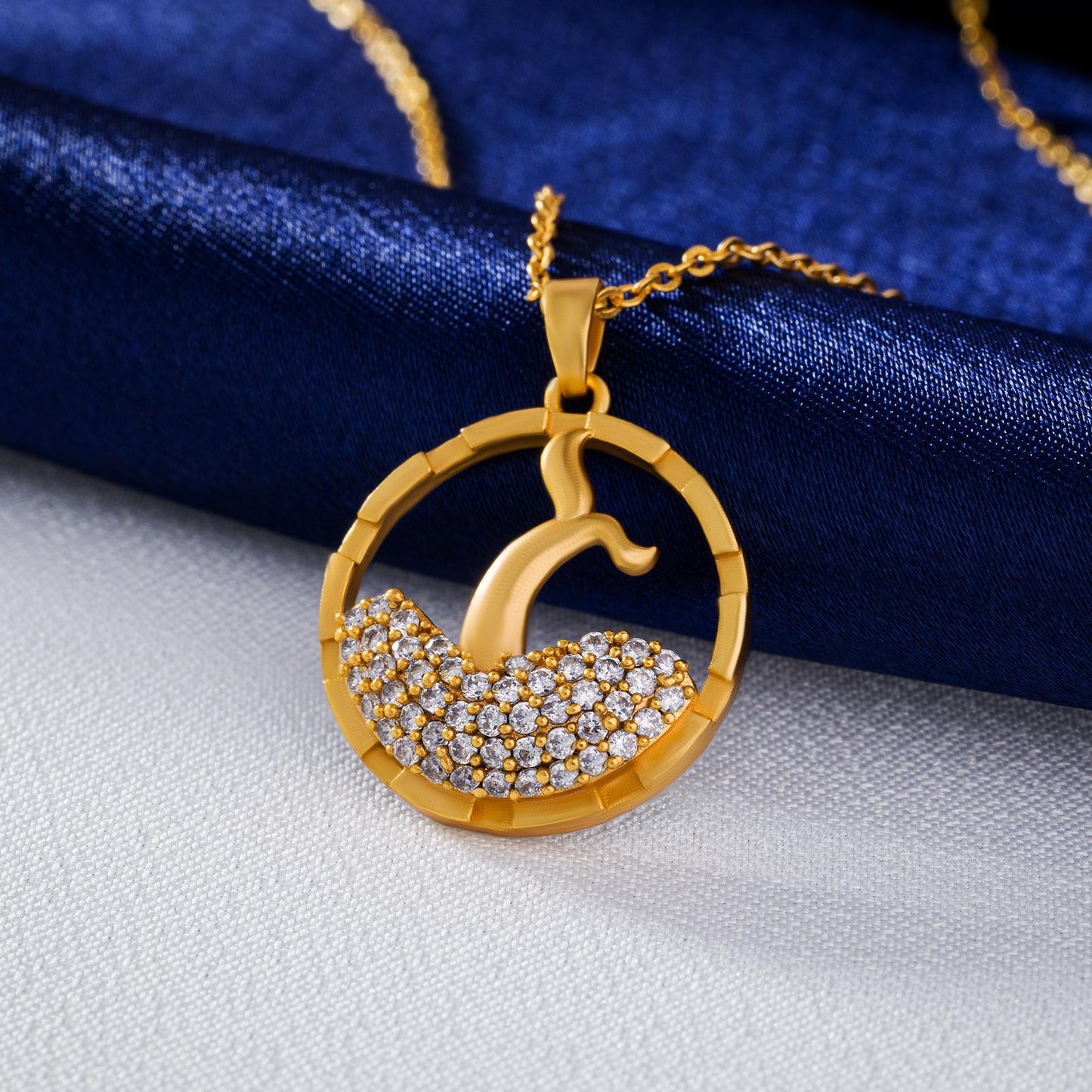 golden necklace with a diamond pendant