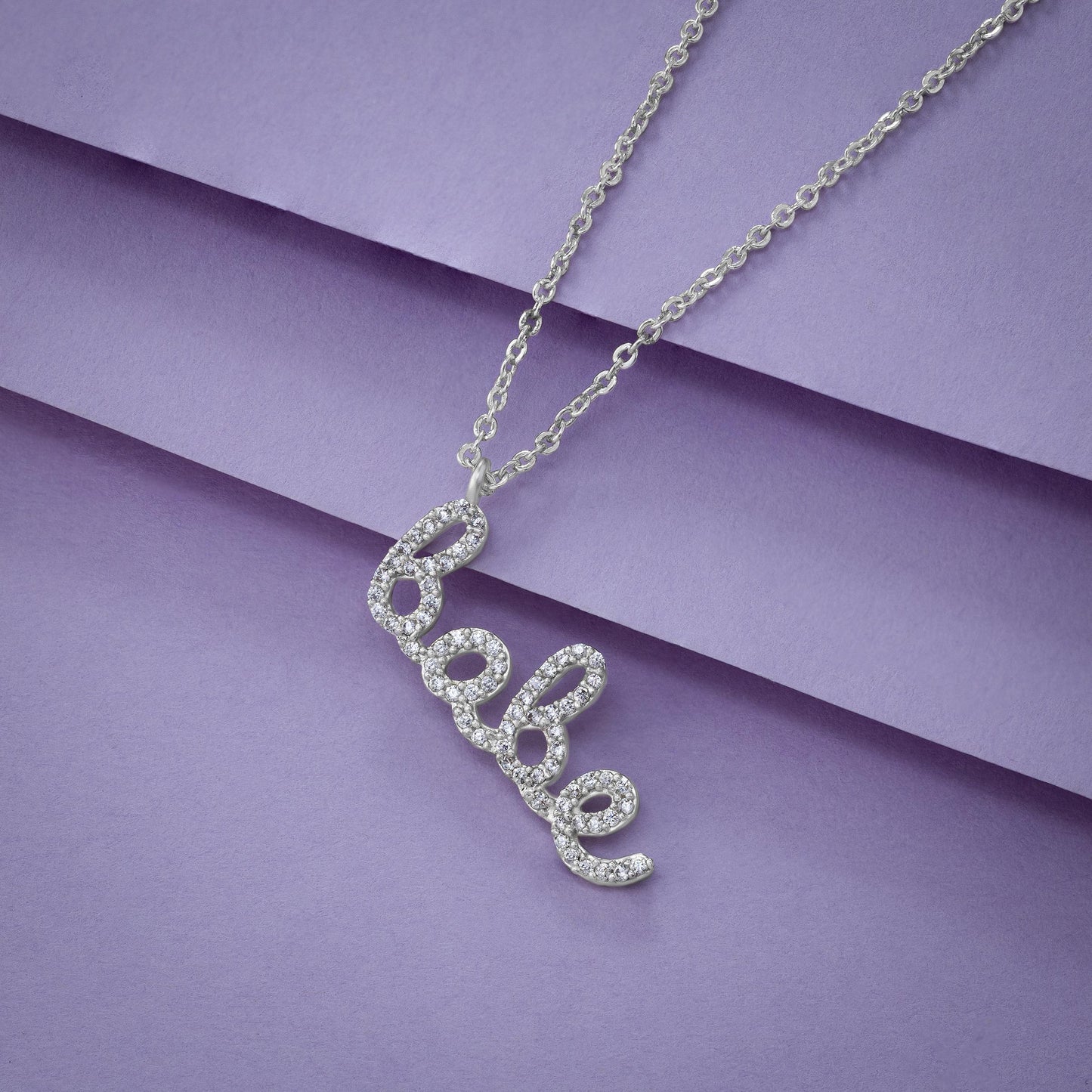 silver necklace with the word love on it